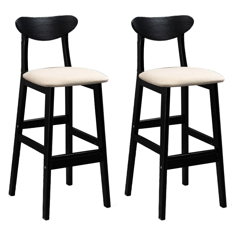 Sgabelli da bar imbottiti da bar in legno solido industriale con gambe nere