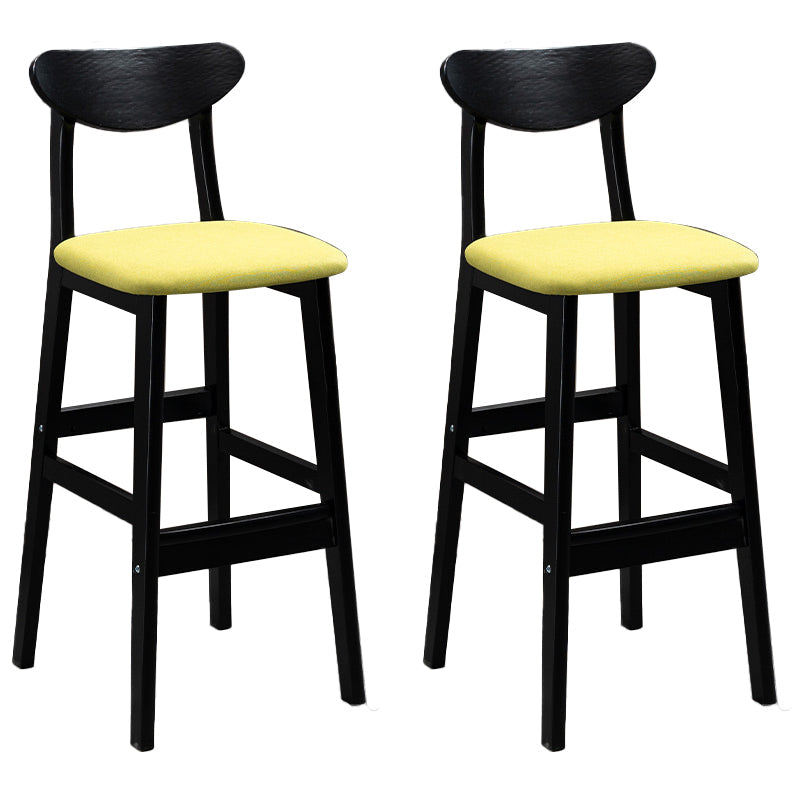 Sgabelli da bar imbottiti da bar in legno solido industriale con gambe nere