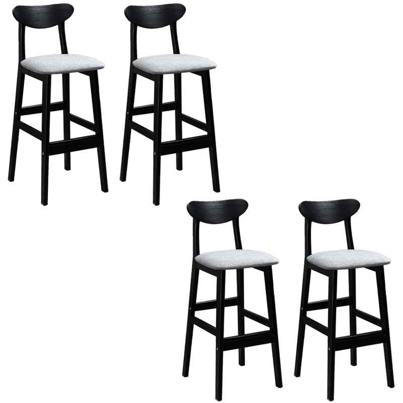 Sgabelli da bar imbottiti da bar in legno solido industriale con gambe nere