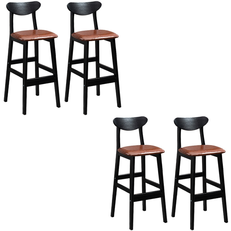 Sgabelli da bar imbottiti da bar in legno solido industriale con gambe nere