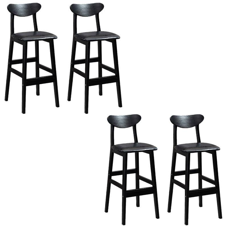 Sgabelli da bar imbottiti da bar in legno solido industriale con gambe nere