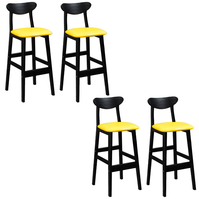 Sgabelli da bar imbottiti da bar in legno solido industriale con gambe nere