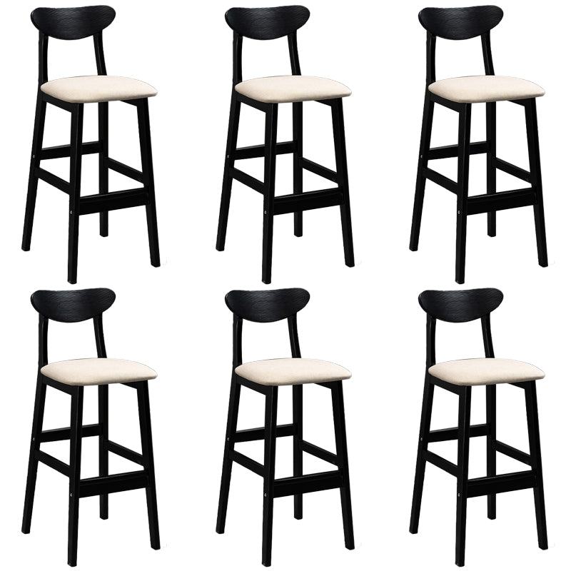 Sgabelli da bar imbottiti da bar in legno solido industriale con gambe nere