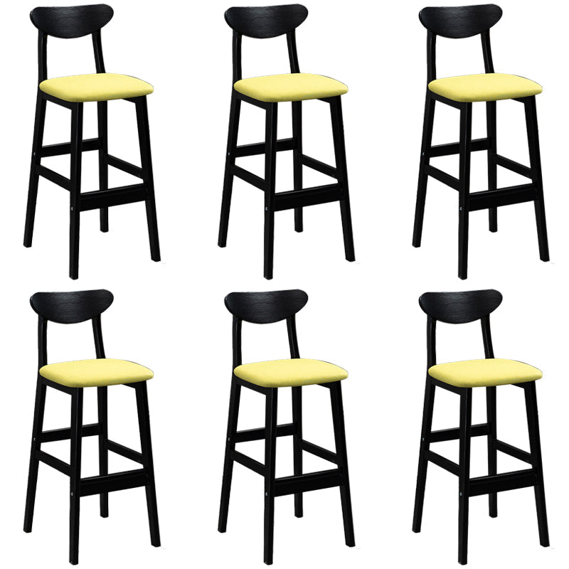 Sgabelli da bar imbottiti da bar in legno solido industriale con gambe nere