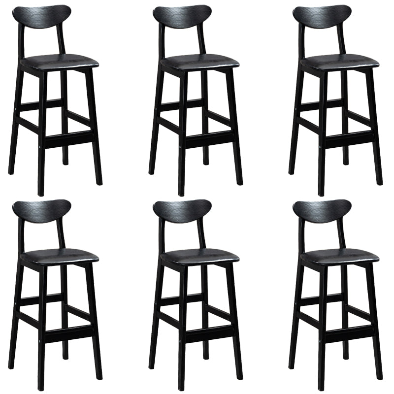 Sgabelli da bar imbottiti da bar in legno solido industriale con gambe nere