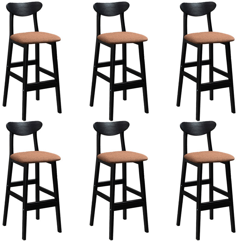 Sgabelli da bar imbottiti da bar in legno solido industriale con gambe nere