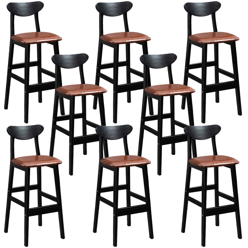 Sgabelli da bar imbottiti da bar in legno solido industriale con gambe nere