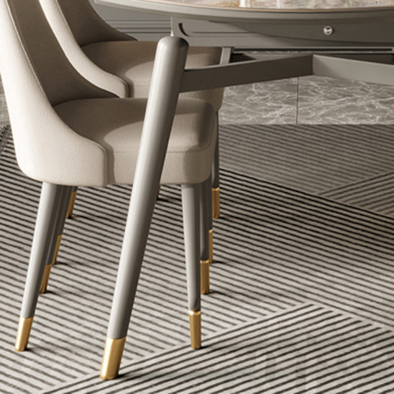 Ausziehbarer Sinterstein -Esstisch mit gepolsterten Stühlen für die Küche