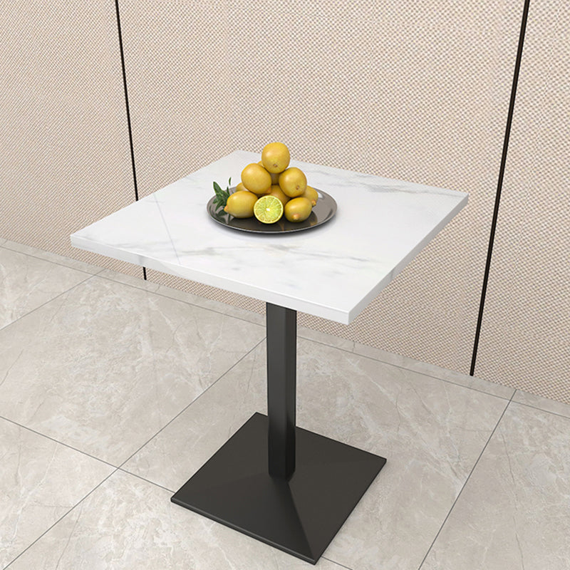 Mesa de comedor de piedra geométrica moderna con base metálica para comedor