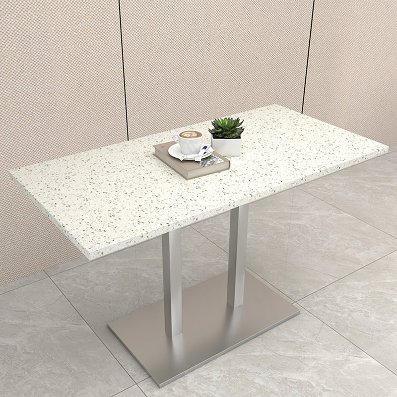 Mesa de comedor de piedra geométrica moderna con base metálica para comedor