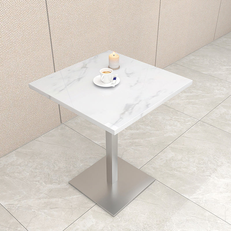 Mesa de comedor de piedra geométrica moderna con base metálica para comedor
