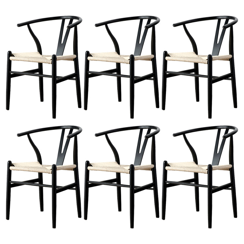 Silla de respaldo moderna de reposabrazos con patas de madera para el comedor