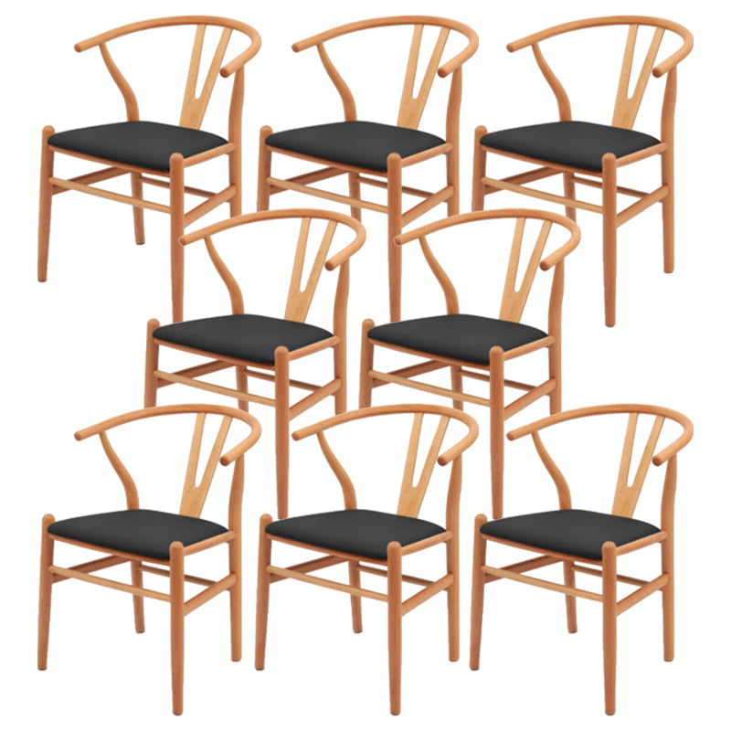 Silla de respaldo moderna de reposabrazos con patas de madera para el comedor