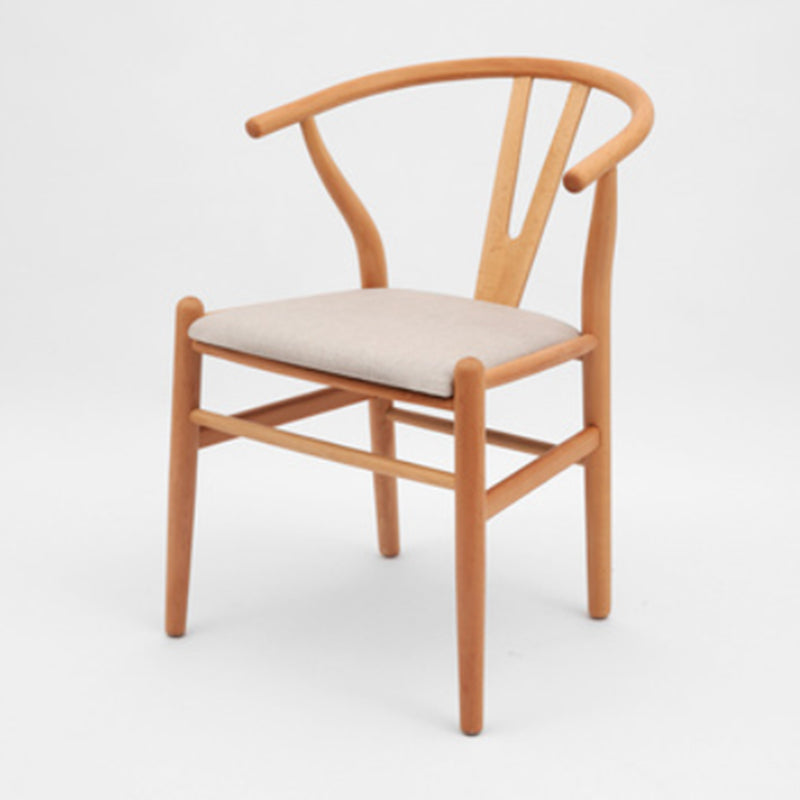 Silla de respaldo moderna de reposabrazos con patas de madera para el comedor