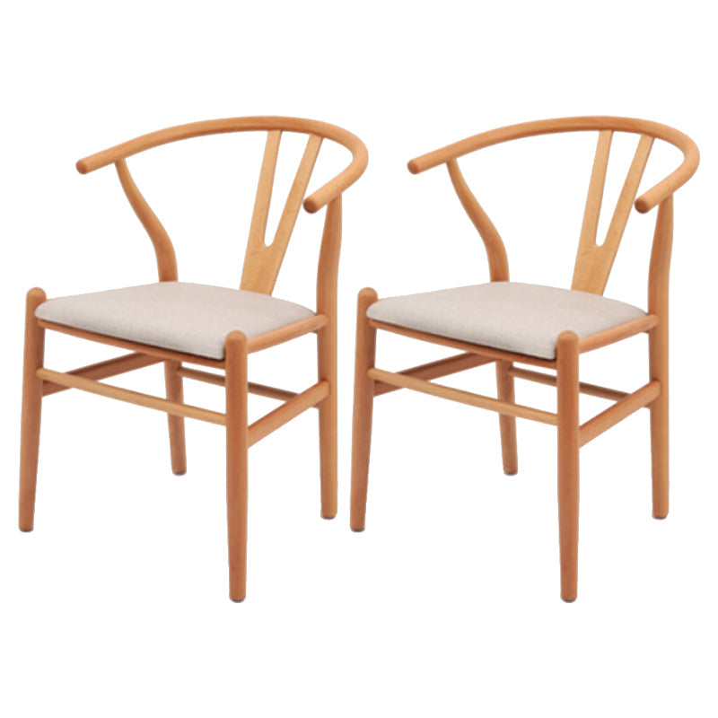 Silla de respaldo moderna de reposabrazos con patas de madera para el comedor