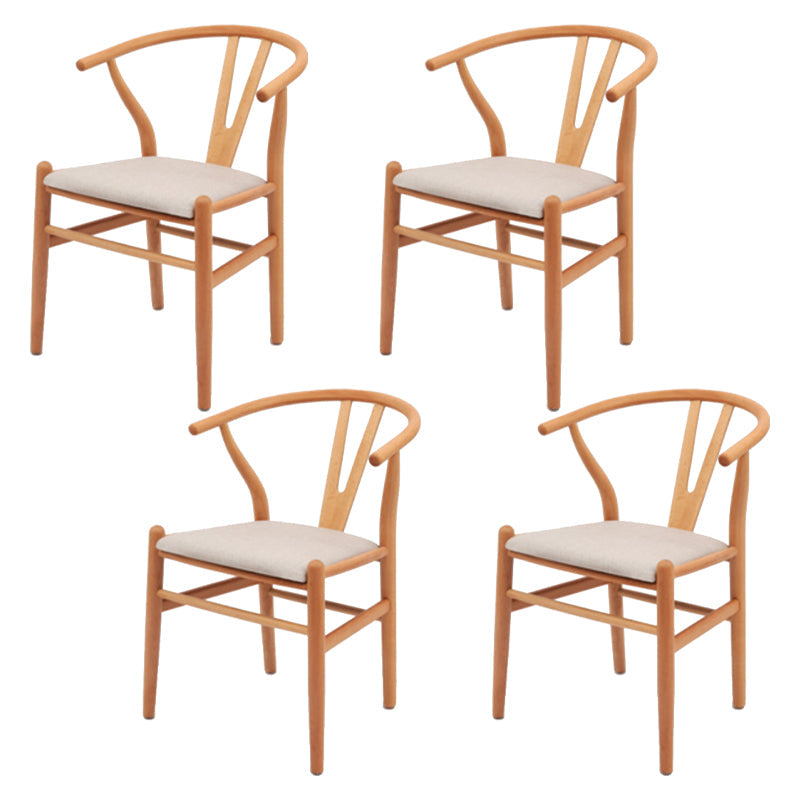 Silla de respaldo moderna de reposabrazos con patas de madera para el comedor