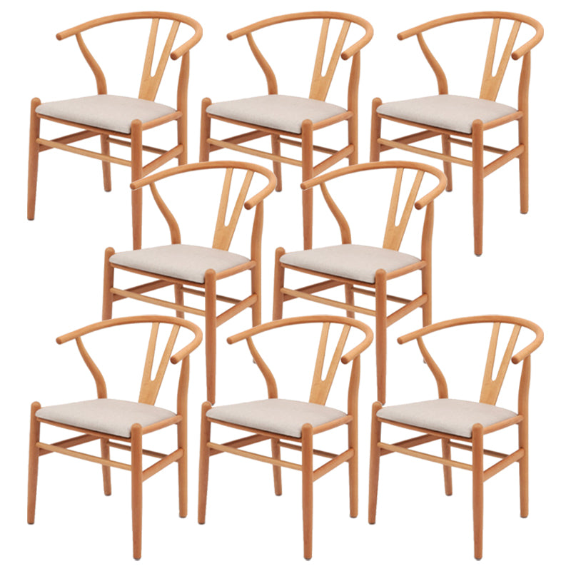 Silla de respaldo moderna de reposabrazos con patas de madera para el comedor