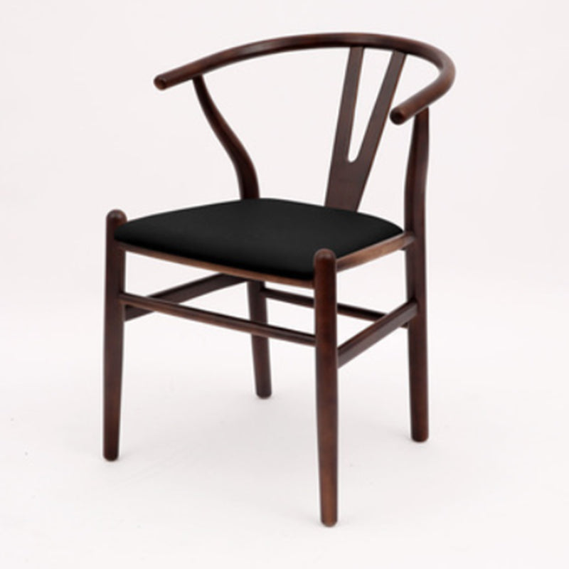 Silla de respaldo moderna de reposabrazos con patas de madera para el comedor