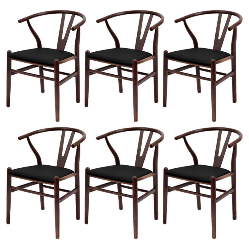 Silla de respaldo moderna de reposabrazos con patas de madera para el comedor