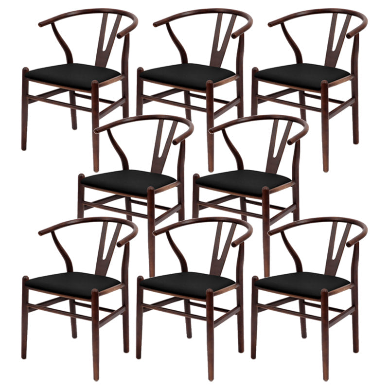 Silla de respaldo moderna de reposabrazos con patas de madera para el comedor