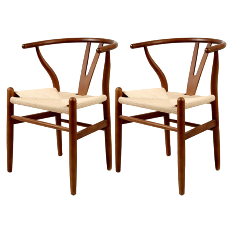 Silla de respaldo moderna de reposabrazos con patas de madera para el comedor