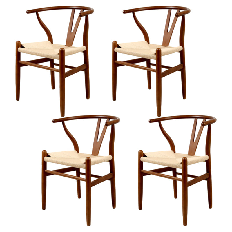 Silla de respaldo moderna de reposabrazos con patas de madera para el comedor