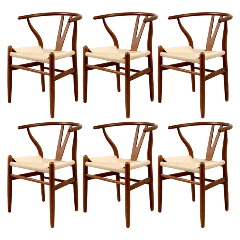 Silla de respaldo moderna de reposabrazos con patas de madera para el comedor