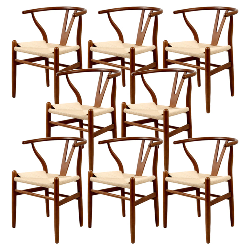 Silla de respaldo moderna de reposabrazos con patas de madera para el comedor