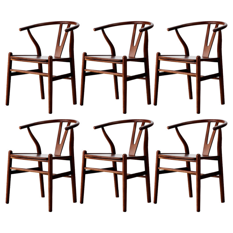 Silla de respaldo moderna de reposabrazos con patas de madera para el comedor