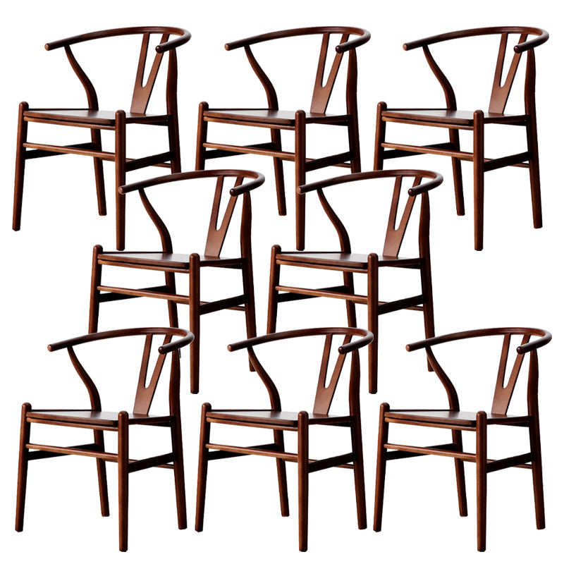 Silla de respaldo moderna de reposabrazos con patas de madera para el comedor