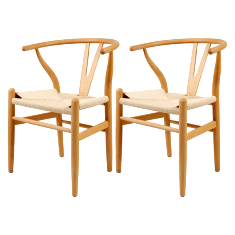 Silla de respaldo moderna de reposabrazos con patas de madera para el comedor