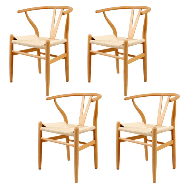 Silla de respaldo moderna de reposabrazos con patas de madera para el comedor