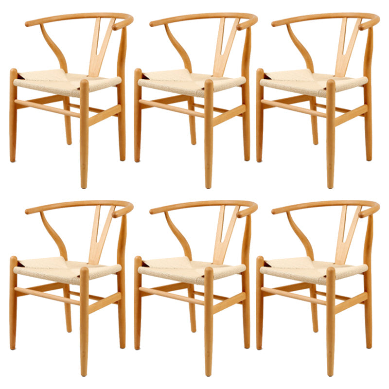 Silla de respaldo moderna de reposabrazos con patas de madera para el comedor