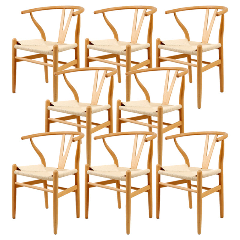 Silla de respaldo moderna de reposabrazos con patas de madera para el comedor