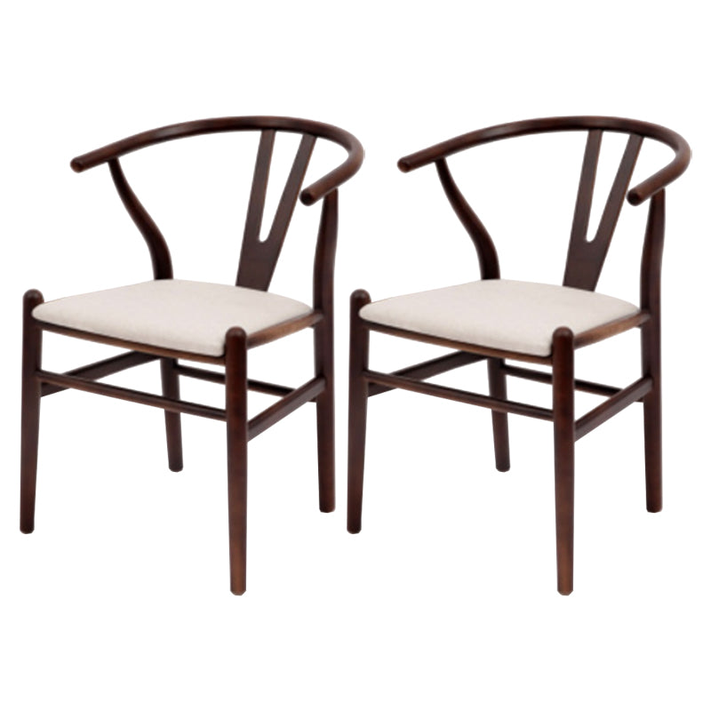 Silla de respaldo moderna de reposabrazos con patas de madera para el comedor