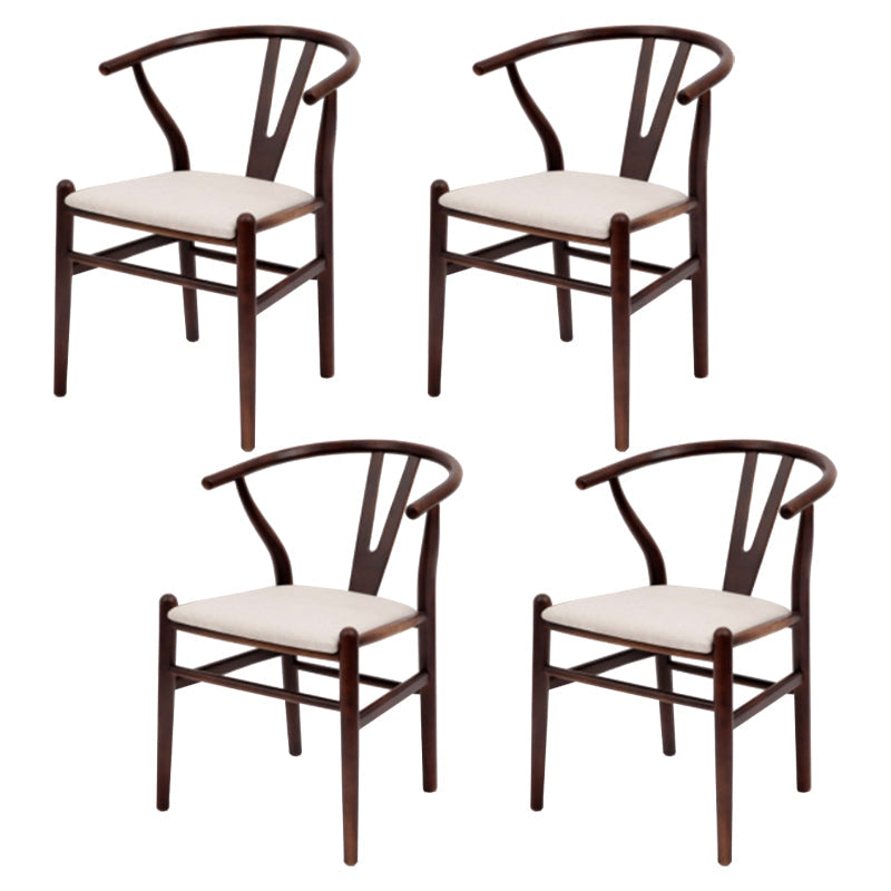 Silla de respaldo moderna de reposabrazos con patas de madera para el comedor