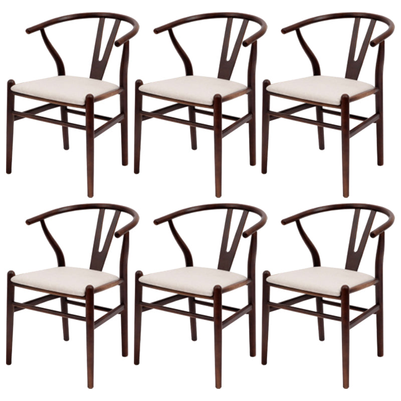 Silla de respaldo moderna de reposabrazos con patas de madera para el comedor