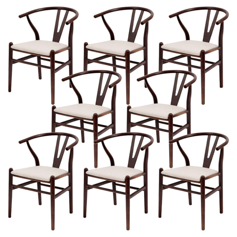 Silla de respaldo moderna de reposabrazos con patas de madera para el comedor