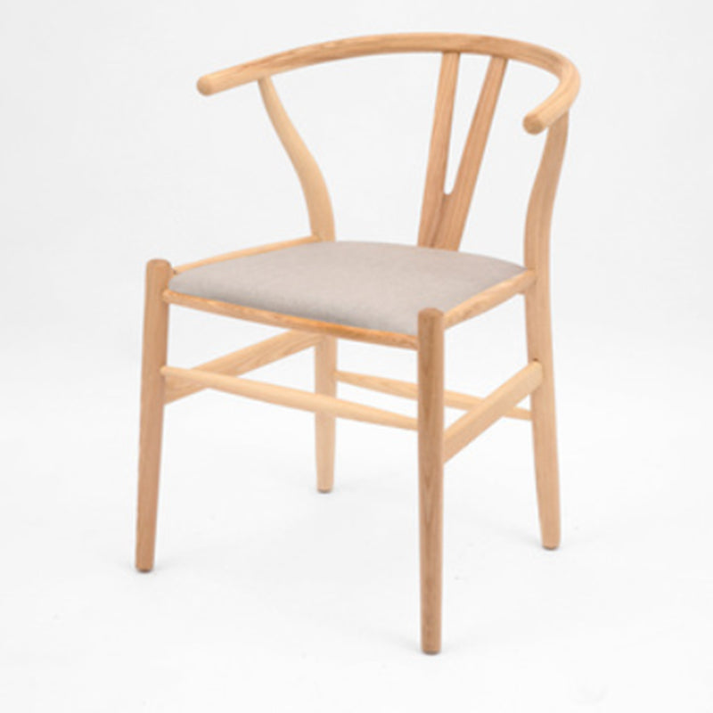 Silla de respaldo moderna de reposabrazos con patas de madera para el comedor