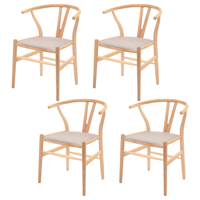 Silla de respaldo moderna de reposabrazos con patas de madera para el comedor