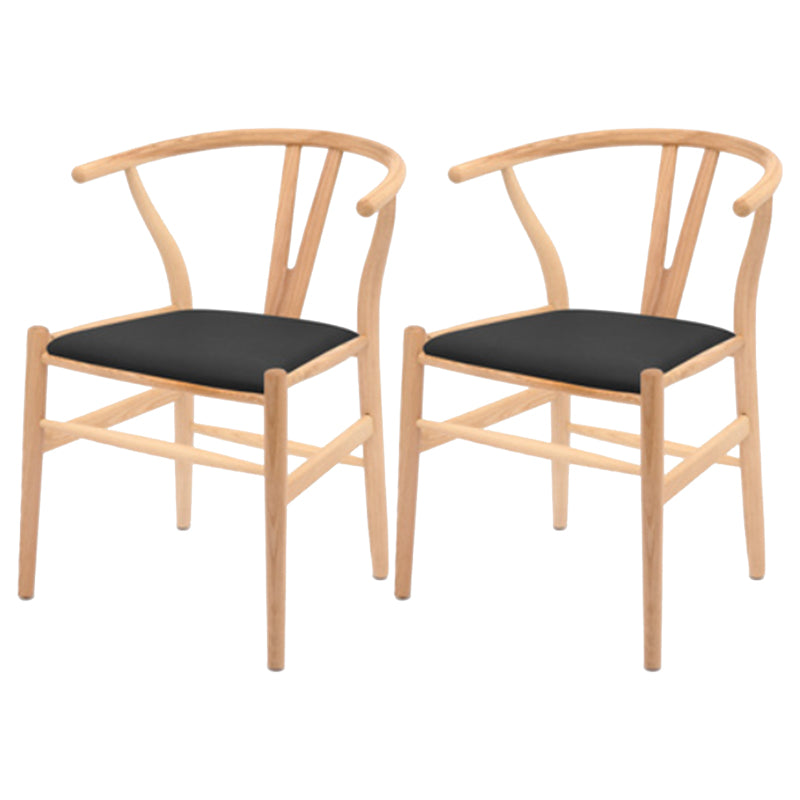 Silla de respaldo moderna de reposabrazos con patas de madera para el comedor