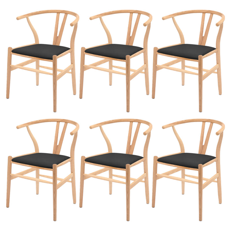 Silla de respaldo moderna de reposabrazos con patas de madera para el comedor