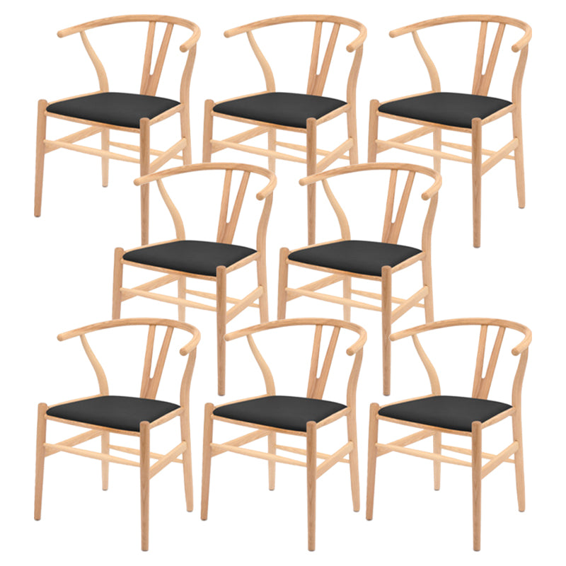 Silla de respaldo moderna de reposabrazos con patas de madera para el comedor