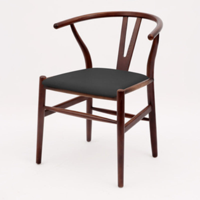 Silla de respaldo moderna de reposabrazos con patas de madera para el comedor