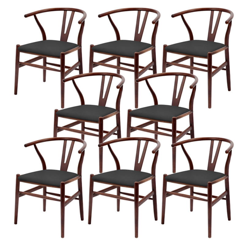 Silla de respaldo moderna de reposabrazos con patas de madera para el comedor