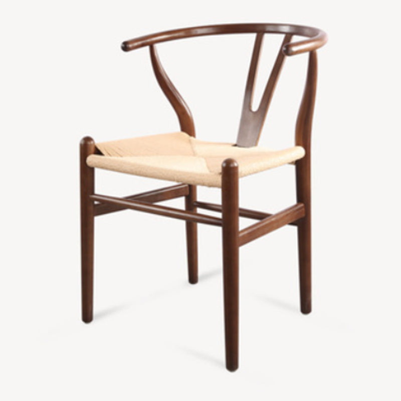 Silla de respaldo moderna de reposabrazos con patas de madera para el comedor