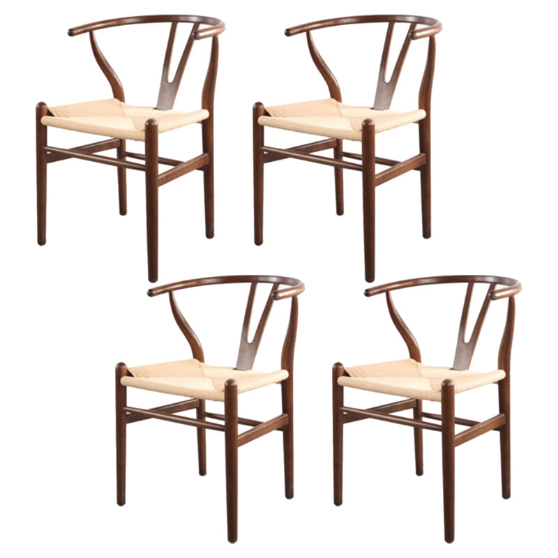 Silla de respaldo moderna de reposabrazos con patas de madera para el comedor