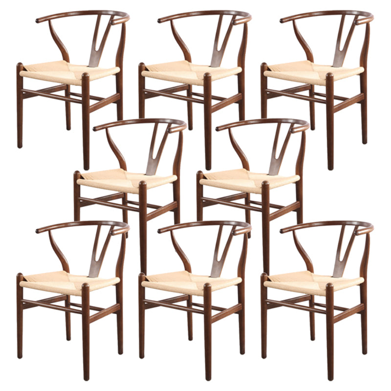 Silla de respaldo moderna de reposabrazos con patas de madera para el comedor