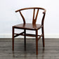 Silla de respaldo moderna de reposabrazos con patas de madera para el comedor