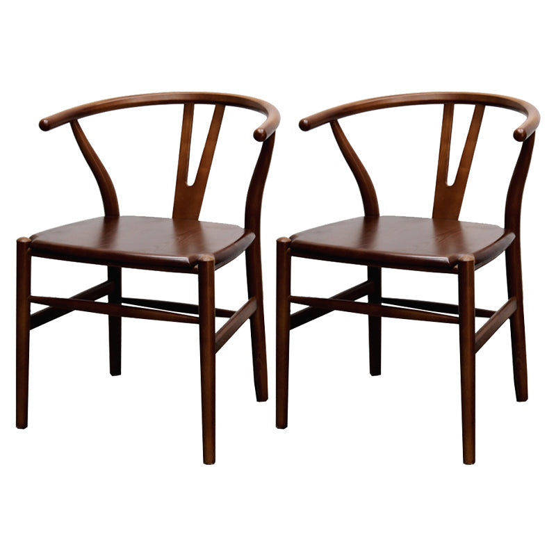 Silla de respaldo moderna de reposabrazos con patas de madera para el comedor